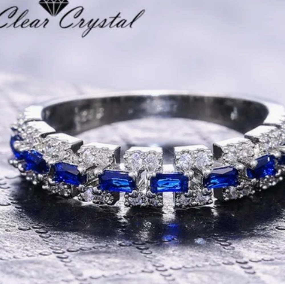 Sapphire blue and clear crystal ring